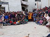 Mustang Lo Manthang Tiji Festival Day 2 14-2 Skeleton Dancers Attack Demon Doll The two skeleton dancers at the Tiji Festival in Lo Manthang attached a string to each arm of the demon doll and swung it into the air and hit it off the ground. Ouch.